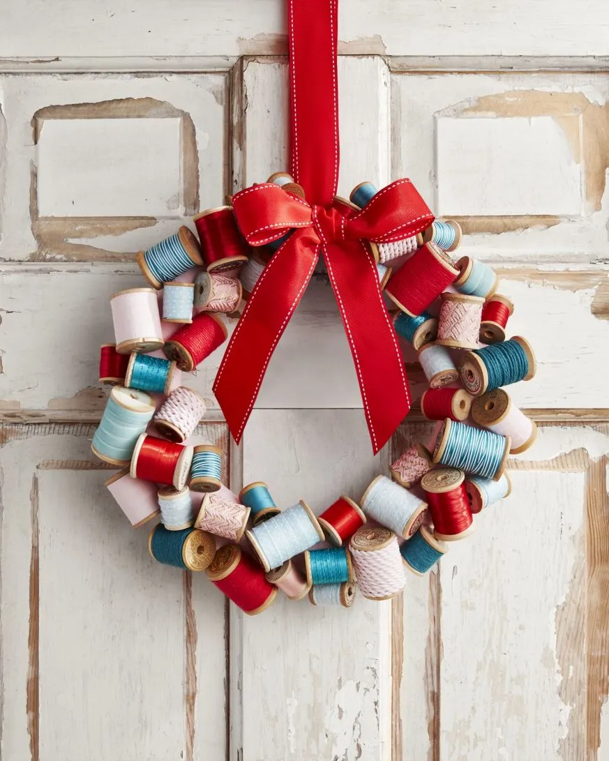 Go green by upcycling spools into a wreath as Christmas decoration