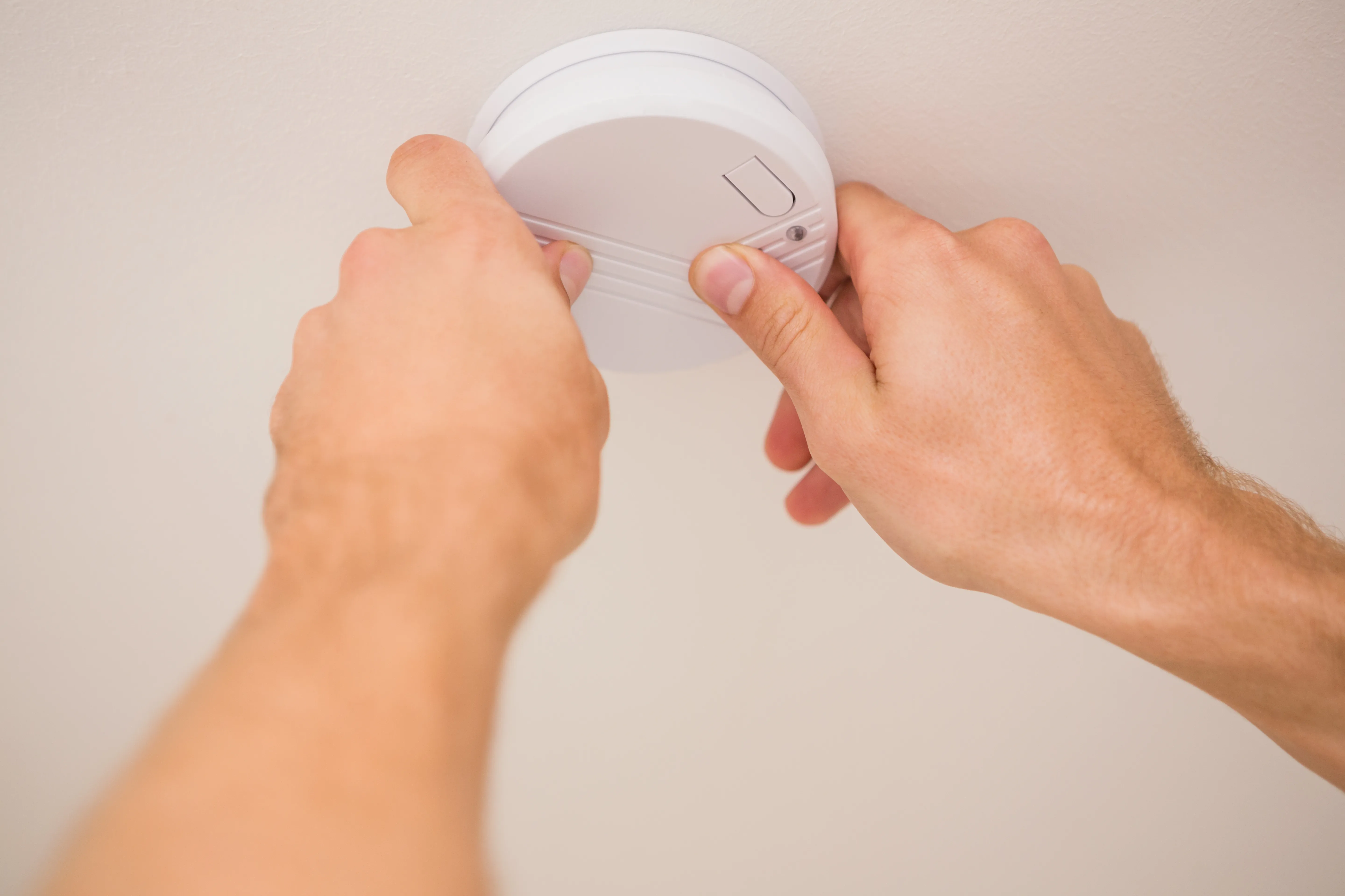 Test smoke alarms in safe location.