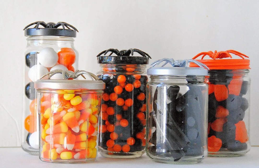 Place your favorite candy or candy corn in these jars.