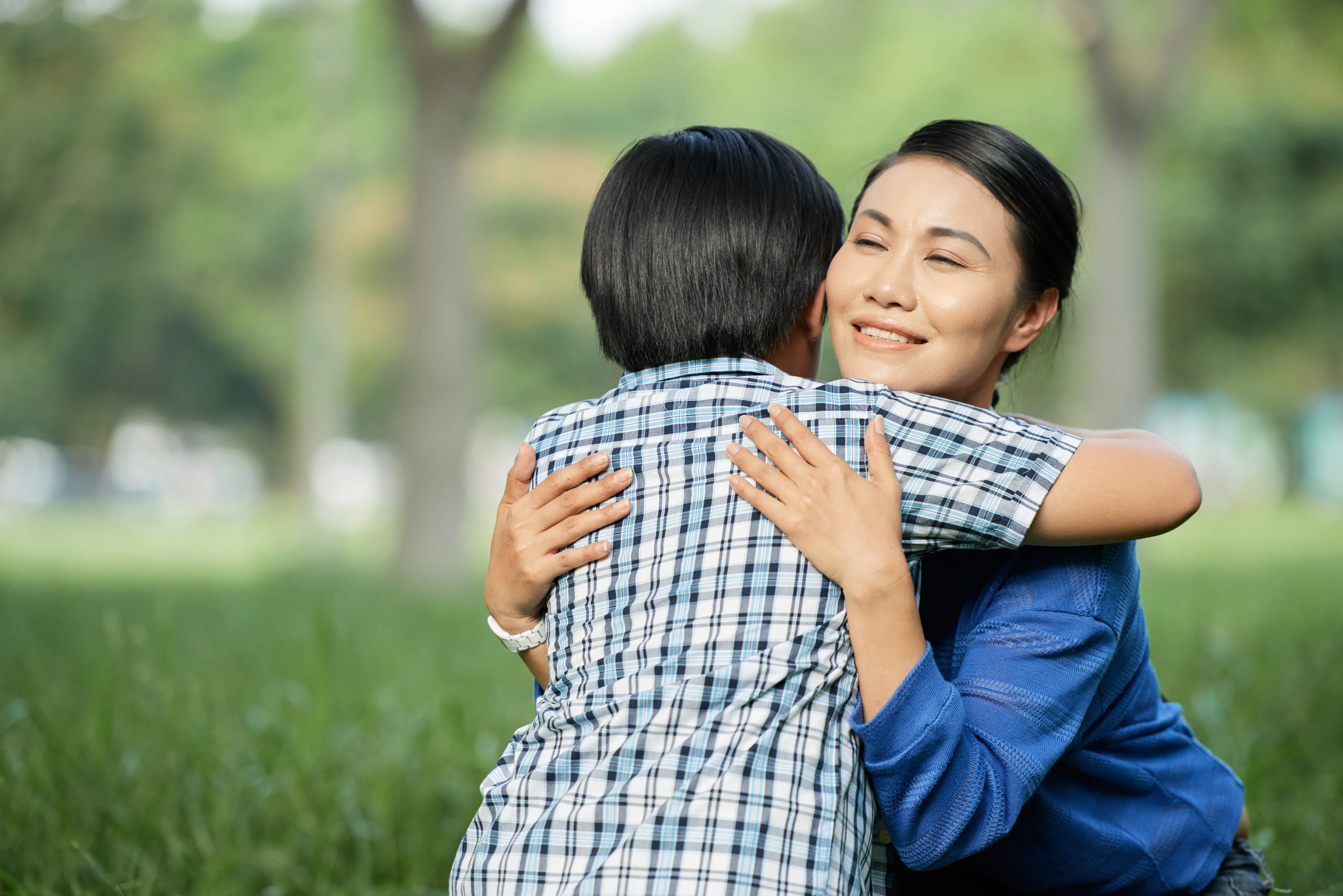 loving mother embracing little son lumina homes