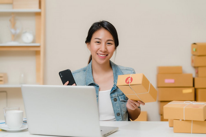 beautiful smart asian young entrepreneur business woman owner sme checking product stock scan qr code working home lumina homes house and lot for sale philippines