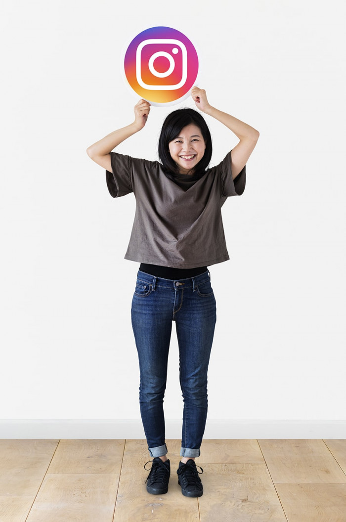 cheerful woman showing instagram lumina homes house and lot for sale philippines